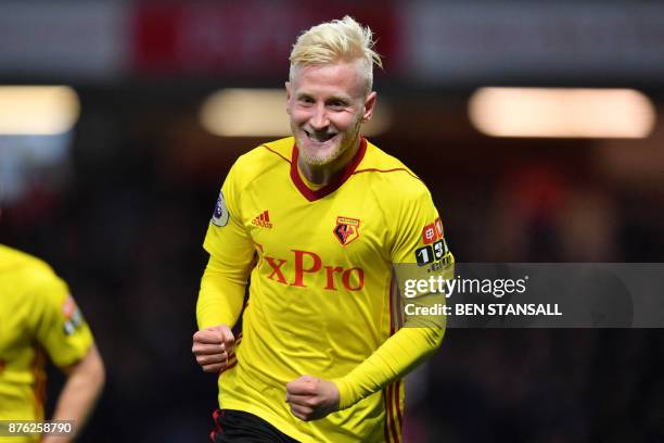 Watford's English midfielder Will Hughes celebrates scoring the opening goal during the English Premier League football match between Watford and...