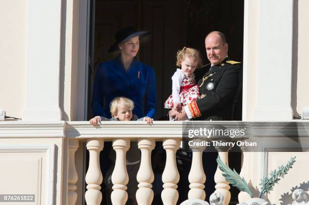 Princess Charlene of Monaco with Prince Jacques of Monaco, Prince Albert II of Monaco with Princess Gabriella of Monaco greet the crowd from the...