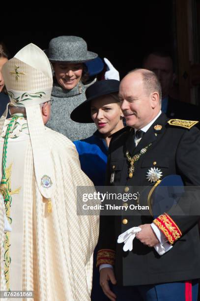 Princess Charlene of Monaco and Prince Albert II of Monaco leave the Cathedral of Monaco after a mass during the Monaco National Day Celebrations on...