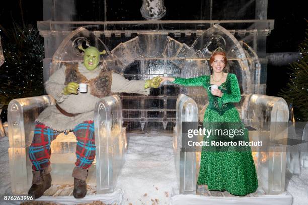 Steffan Harrs, performing as Shrek, and Laura Main, performing as Fiona, attend a photocall at Ice Adventures during 'Light Night', the event that...