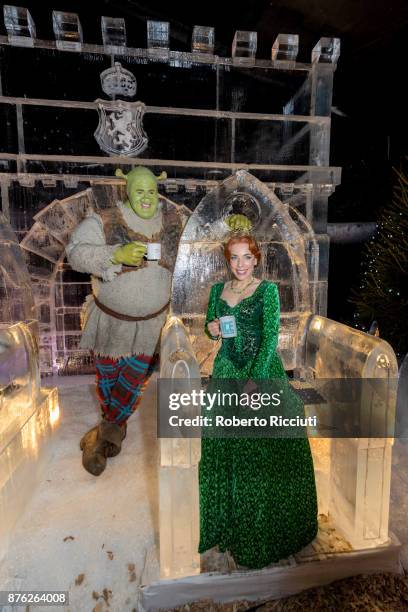 Steffan Harrs, performing as Shrek, and Laura Main, performing as Fiona, attend a photocall at Ice Adventures during 'Light Night', the event that...