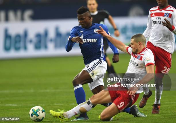 Hamburg's Greek defender Kiriakos Papadopoulos and Schalke's Swiss midfielder Breel Embolo vie for the ball during the German First division...