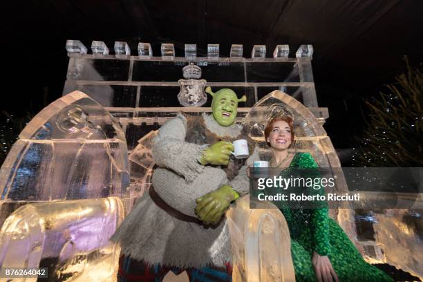 Steffan Harrs, performing as Shrek, and Laura Main, performing as Fiona, attend a photocall at Ice Adventures during 'Light Night', the event that...