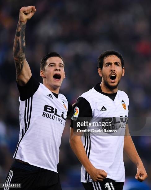 Santi Mina and Dani Parejo of Valencia CF celebrate after Geoffrey Kondogbia of Valencia CF scored the opening goal past Pablo Piatti and Javi Fuego...