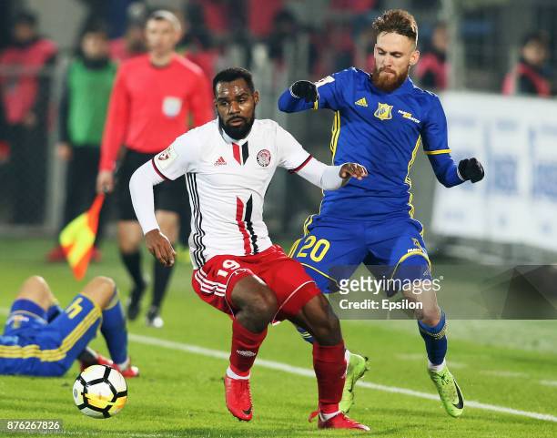 Zan Majer of FC Rostov Rostov-on-Don vies for the ball with Brian Idowu of FC Amkar Perm during the Russian Premier League match between FC Rostov...