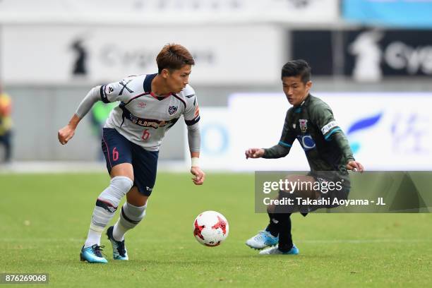 Kosuke Ota of FC Tokyo takes on Akito Fukuta of Sagan Tosu during the J.League J1 match between Sagan Tosu and FC Tokyo at Best Amenity Stadium on...