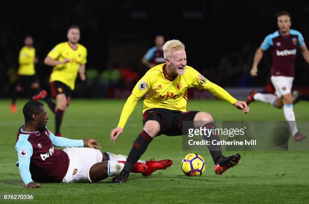 Will Hughes of Watford is tackled by Pedro Obiang of West Ham United during the Premier League match between Watford and West Ham United at Vicarage...
