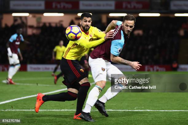 Miguel Britos of Watford and Marko Arnautovic of West Ham United watch the ball during the Premier League match between Watford and West Ham United...