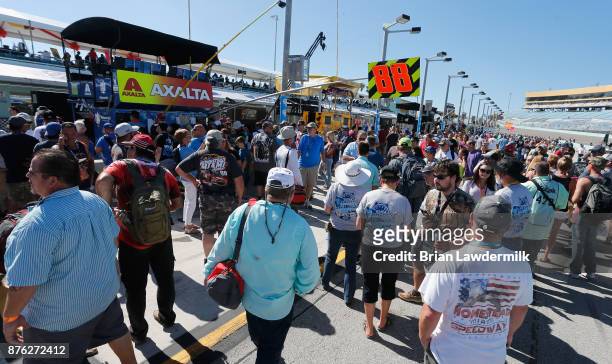 Fans walk on pit road prior to the Monster Energy NASCAR Cup Series Championship Ford EcoBoost 400 at Homestead-Miami Speedway on November 19, 2017...