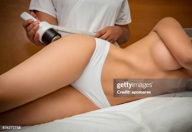 cavitation for cellulite treatment on legs - abdomen exam stock pictures, royalty-free photos & images