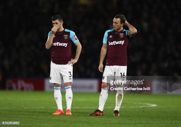 Aaron Cresswell and Mark Noble of West Ham United look dejected during the Premier League match between Watford and West Ham United at Vicarage Road...