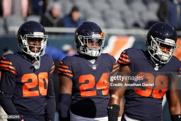 Prince Amukamara, Jordan Howard, and Adrian Amos of the Chicago Bears warm up prior to the game against the Detroit Lions at Soldier Field on...