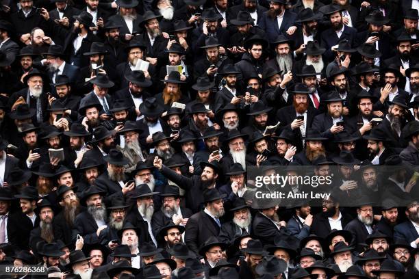 Hasidic Rabbis prepare to pose a group photo, part of the annual International Conference of Chabad-Lubavitch Emissaries, in front of Chabad...