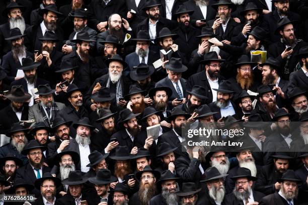 Hasidic rabbis prepare to pose a group photo, part of the annual International Conference of Chabad-Lubavitch Emissaries, in front of Chabad...