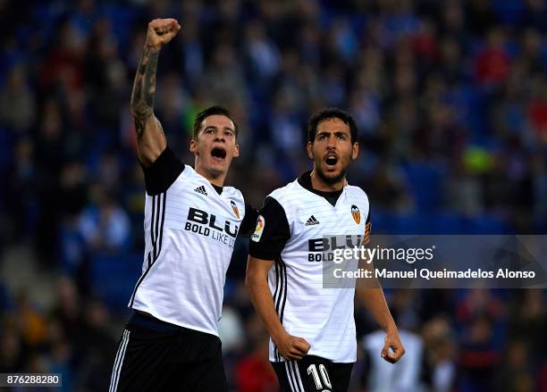 Santi Mina of Valencia celebrates with his teammate Daniel Parejo during the La Liga match between Espanyol and Valencia at Cornella-El Prat stadium...