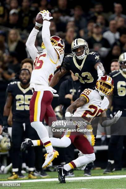 Swearinger of the Washington Redskins intercepts a pass from Drew Brees of the New Orleans Saints during the first half at the Mercedes-Benz...