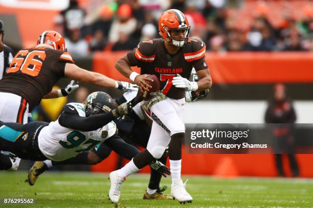 Malik Jackson of the Jacksonville Jaguars moves to tackle DeShone Kizer of the Cleveland Browns in the first quarter at FirstEnergy Stadium on...