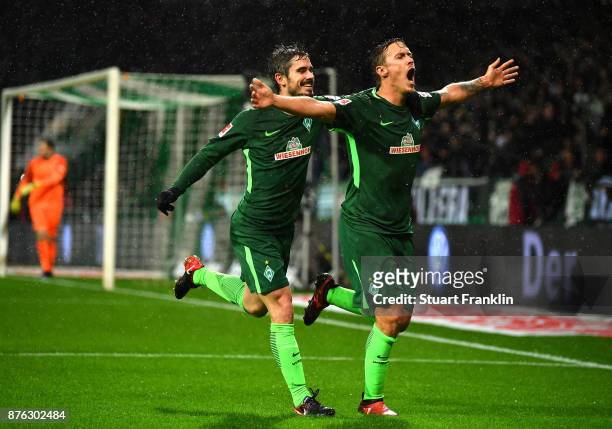 Max Kruse of Bremen celebrates scoring his second goal with Fin Bartels during the Bundesliga match between SV Werder Bremen and Hannover 96 at...
