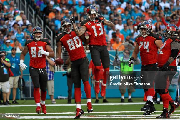 Howard celebrates with teammate Mike Evans of the Tampa Bay Buccaneers after scoring a touchdown during the second quarter against the Miami Dolphins...