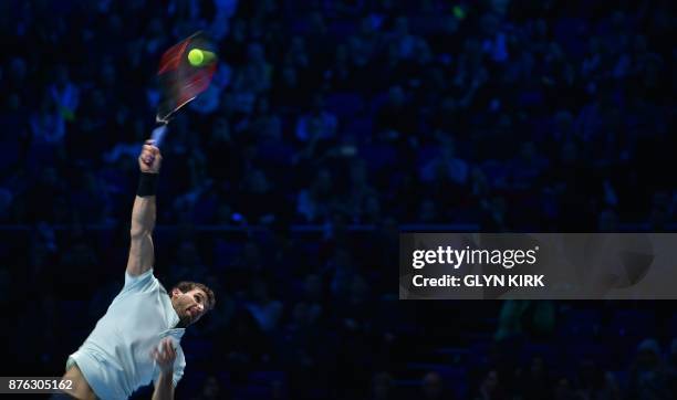 Bulgaria's Grigor Dimitrov serves to Belgium's David Goffin during their men's singles final match on day eight of the ATP World Tour Finals tennis...