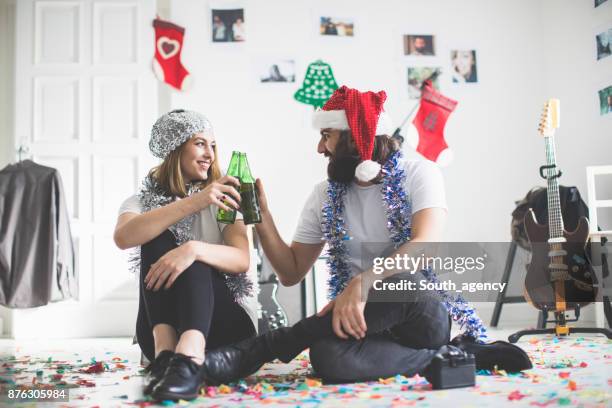 two people party - christmas cool attitude stock pictures, royalty-free photos & images