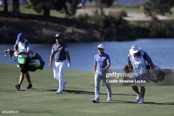 Brian Gay and Austin Cook of the United States walk up the fairway on the seventh hole during the third round of The RSM Classic at Sea Island Golf...