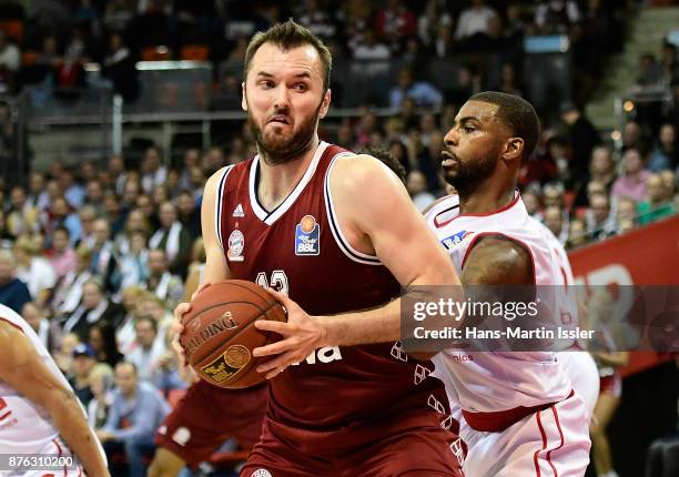 Milan Macvan of FC Bayern Muenchen under pressure from Dorell Wright of Brose Bamberg during the BBL Basketball Bundesliga match between FC Bayern...