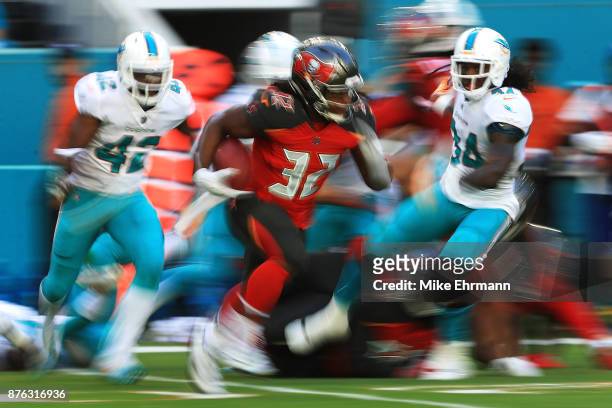 Jacquizz Rodgers of the Tampa Bay Buccaneers rushes during the first quarter against the Miami Dolphins at Hard Rock Stadium on November 19, 2017 in...
