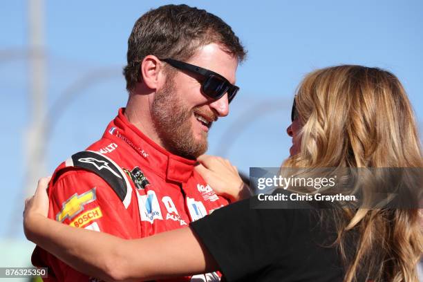 Dale Earnhardt Jr., driver of the AXALTA Chevrolet, and his wife Amy during pre-race ceremonies for the Monster Energy NASCAR Cup Series Championship...