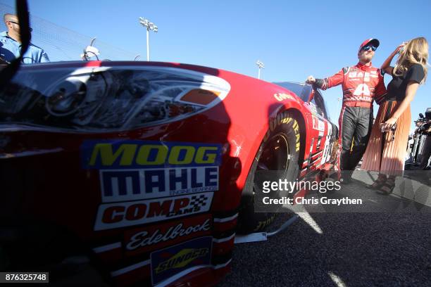 Dale Earnhardt Jr., driver of the AXALTA Chevrolet, and his wife Amy take part in pre-race ceremonies for the Monster Energy NASCAR Cup Series...