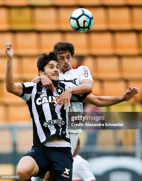 Igor Rabello of Botafogo and Rodrigo Caio of Sao Paulo in action during the match for the Brasileirao Series A 2017 at Pacaembu Stadium on November...