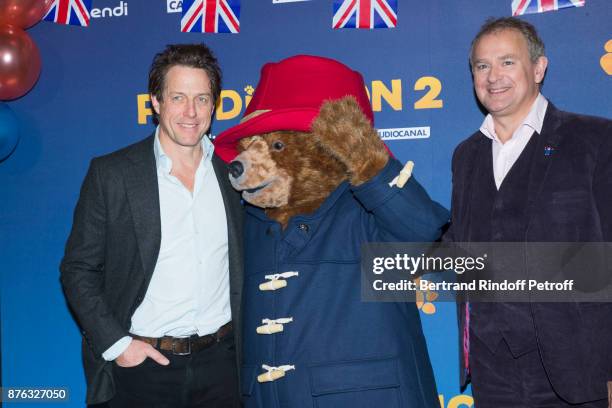 Actors Hugh Grant and Hugh Bonneville attend "Paddington 2" Paris Premiere at L'Olympia on November 19, 2017 in Paris, France.