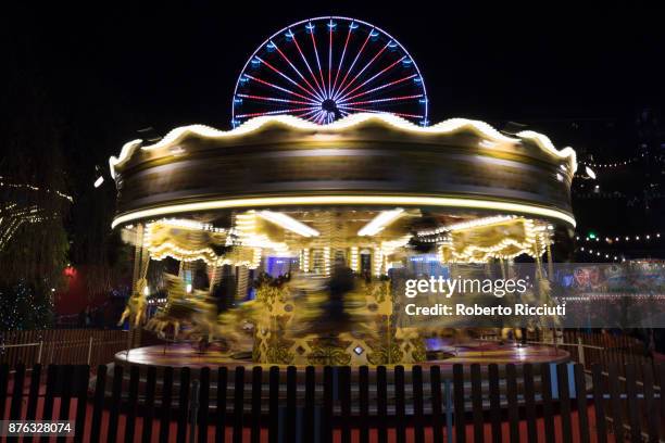 Members of the public enjoy the Carousel, one of a number of attractions situated in Princes Street Gardens in Edinburgh during 'Light Night', the...