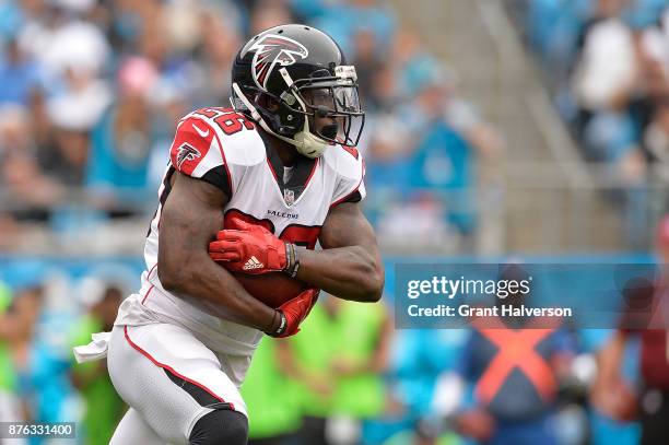Tevin Coleman of the Atlanta Falcons runs against the Carolina Panthers during their game at Bank of America Stadium on November 5, 2017 in...