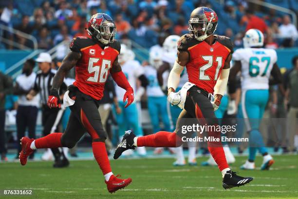 Justin Evans and Kwon Alexander of the Tampa Bay Buccaneers during the first quarter against the Miami Dolphins at Hard Rock Stadium on November 19,...