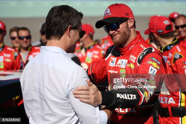 Dale Earnhardt Jr., driver of the AXALTA Chevrolet, and speaks to former NASCAR driver Jeff Gordon during pre-race ceremonies for the Monster Energy...