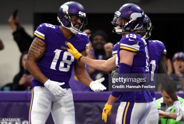 Adam Thielen of the Minnesota Vikings and Michael Floyd celebrate after scoring a touchdown in the fourth quarter of the game against the Los Angeles...