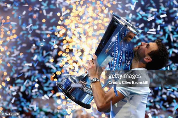 Grigor Dimitrov of Bulgaria kisses the trophy as he celebrates victory during the singles final against David Goffin of Belgium during day eight of...