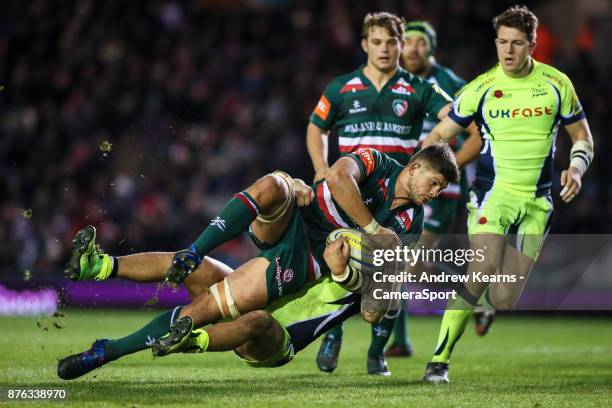 Leicester Tigers' Mike Williams is tackled by Sale Sharks' Sam James during the Aviva Premiership match between Leicester Tigers and Sale Sharks at...