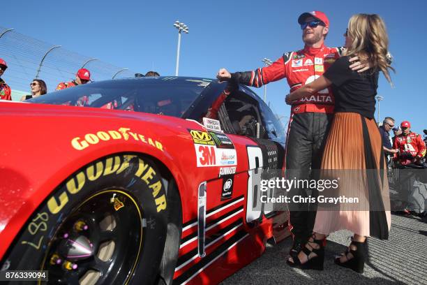 Dale Earnhardt Jr., driver of the AXALTA Chevrolet, and his wife Amy during pre-race ceremonies for the Monster Energy NASCAR Cup Series Championship...