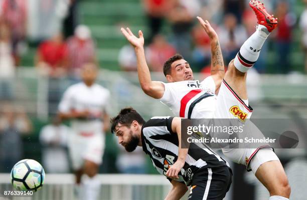 Joao Paulo of Botafogo and Gilberto of Sao Paulo in action during the match for the Brasileirao Series A 2017 at Pacaembu Stadium on November 19,...