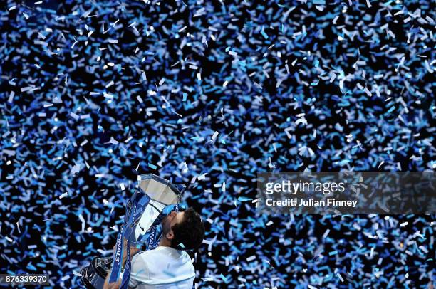 Grigor Dimitrov of Bulgaria lifts the trophy as he celebrates victory following the singles final against David Goffin of Belgium during day eight of...
