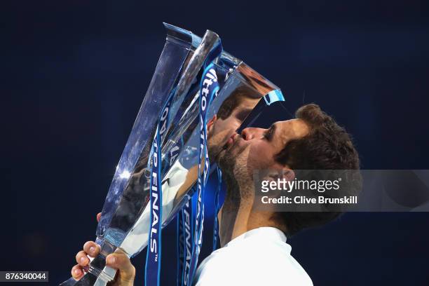 Grigor Dimitrov of Bulgaria kisses the trophy as he celebrates victory following the singles final against David Goffin of Belgium during day eight...