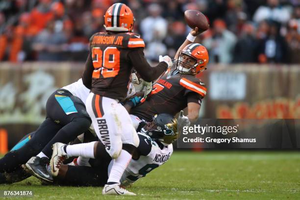 DeShone Kizer of the Cleveland Browns is sacked by Malik Jackson of the Jacksonville Jaguars at FirstEnergy Stadium on November 19, 2017 in...