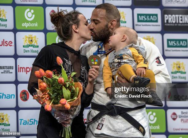 Over 100kg champion, Roy Meyer of the Netherlands stands on the top podium with his wife, Doree and their son Micah during the The Hague Grand Prix,...