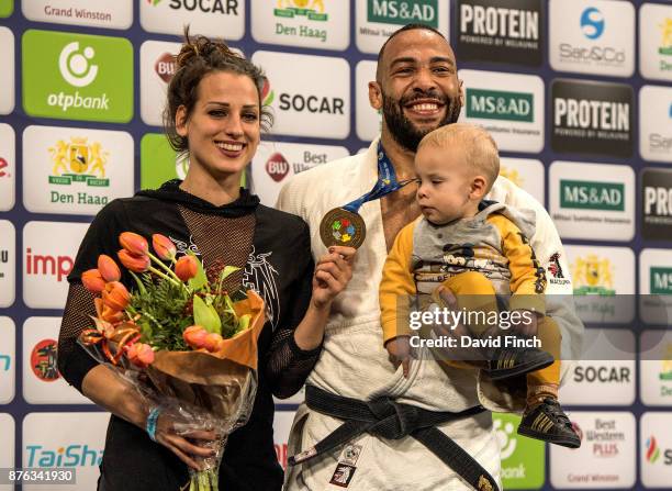 Over 100kg champion, Roy Meyer of the Netherlands stands on the top podium with his wife, Doree and their son Micah during the The Hague Grand Prix,...