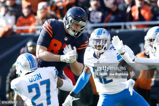 Adam Shaheen of the Chicago Bears is hit by Glover Quin of the Detroit Lions in the first quarter at Soldier Field on November 19, 2017 in Chicago,...