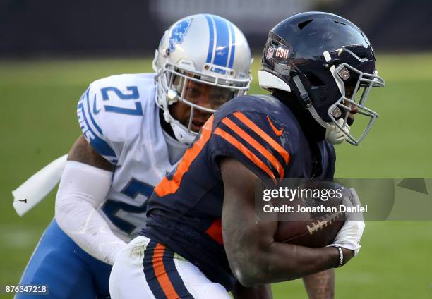 Tarik Cohen of the Chicago Bears carries the football against Glover Quin of the Detroit Lions in the third quarter at Soldier Field on November 19,...