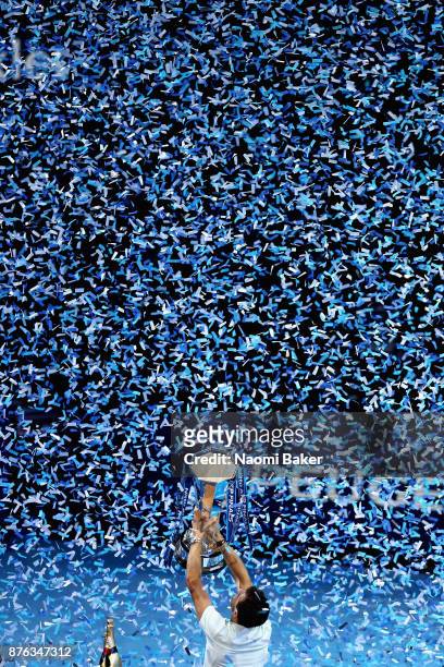 Grigor Dimitrov of Bulgaria lifts the trophy following victory in the mens singles final against David Goffin of Belgium during day eight of the 2017...