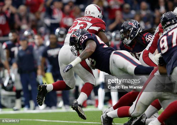 Benardrick McKinney of the Houston Texans hits Adrian Peterson of the Arizona Cardinals behind the line of scrimmage in the fourth quarter at NRG...